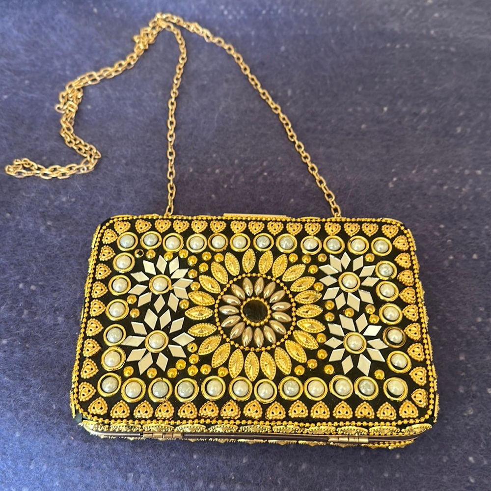 Small dressy bag, measure seven inches wide, 4 1/2 long. Never used.